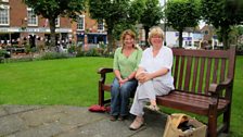 Steph and Jo on a bench in Broseley