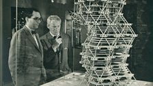 Louis Kahn in front of a model of the City Tower Project in an exhibition at Cornell University, Ithaca, New York