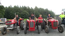 Tractors and their drivers taking part in a vintage tractor run to raise money for charity