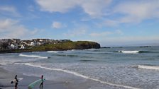 Portrush's west strand - surfers come from round the world to surf Ireland's waves, including thousands who come for lessons.