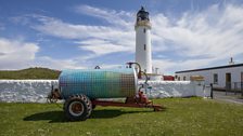 Completed tanker, in front of the lighthouse