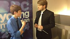 Elliott Gaston-Ross has a last minute conversation with conductor Kirill Karabits before performing his chosen concerto