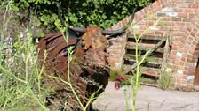 Rusted cow sculpture