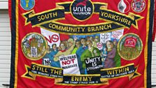 Ed Hall, Banner for UNITE the union at the march in support of the NHS in Manchester, 29th September 2013