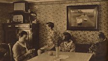 Family Gathered round the Radio at Home