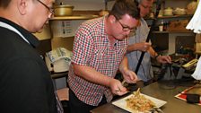 John Toal tasting up some of Jeremy Chan's Bang Bang Chicken