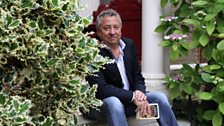 Tony Jordan outside the Dickens Museum in London, holding his own well-thumbed copy of Great Expectations