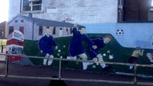 Mural of old bungalows at Taughmonagh shops