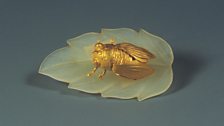 Golden cicada on jade leaf