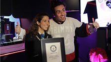 Grimmy gets his certificate from Anna at the Guinness World Records panel