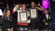 Grimmy and Greg with their certificates, one happier than the other..