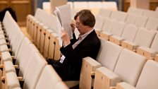 Georg Friedrich Haas studying the score of his Concerto Grosso no. 1 for Alpine Horn Quartet and Orchestra.