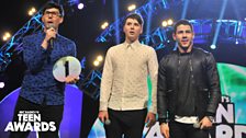 Dan and Phil and Nick Jonas present the Best British Vlogger award