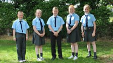 The five in their primary school uniform