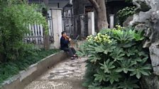 A musician playing outdoors in Hangzhou.