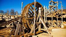 One of Guedelon's wooden treadwheels, with wooden scaffolding behind