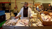 Billingsgate merchant Roger Barton sets out his stall at the New Fulton Fish Market at Hunts Point, New York