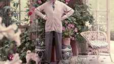 Cecil Beaton with his pug in the Winter Garden, Reddish House 1961