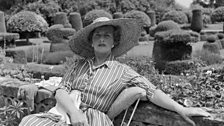 Nancy Lancaster on the terrace by the Chess Garden, Haseley Court, 1950s, by Cecil Beaton