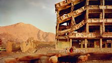 Simon Norfolk, Bullet-scarred apartment building and shops in the Karte Char district of Kabul,  2003