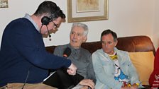 John chats to Age NI volunteer George Bell, and Billy Kirk, one of the authors of the book, 'Recycled Memories'