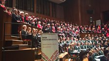 The assembled choirs at the front of the stage