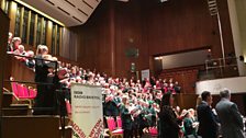 The assembled choirs at the front of the stage