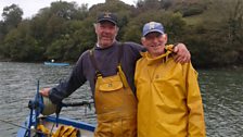 Timmy Heard and Dave Kenderdine aboard their oyster punt at Tolverne.