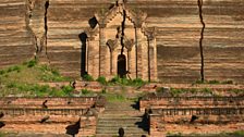 Young monks approach Mingun Pahtodawgyi temple near Mandalay, cracked by an earthquake in 1839