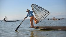 Inle Lake fishermen are famous for being able to row a boat using one leg