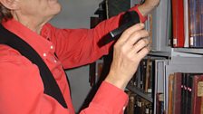 Pete Coe inspects Kidson items on the shelves of The Mitchell Library