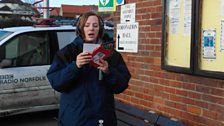 Kirsteen reads her "Happy New Year" card from the Questmaster