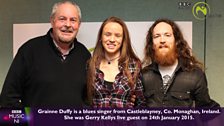 Gerry Kelly stands with blues singer Grainne Duffy and band mate Paul Sherry