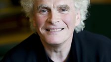 Sir Simon Rattle relaxing backstage