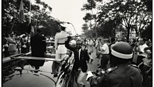 Leopoldville, [Young man steals the sword of King Baudouin I, during procession with newly appointed President Kasavubu]