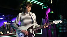 One of Charli XCX's guitarists in the Live Lounge