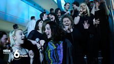 A local choir join Jungle for their 6 Music Festival 2015 set