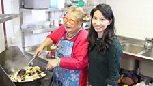 Jing helps TV chef Nancy Lam as she cooks a traditional Chinese New Year dish