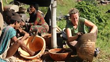 Kate helps finish off some wooden bowls