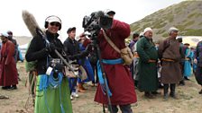 Wearing tranditional dress while ilming at the Yak festival