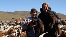 Kate and nomadic herder Ordnor holding baby cashmere goats