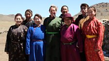 Kate with the family of Nomads she lived with in the Gobi Desert, Omnogovi Province, Mongolia