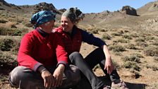 Kate and nomadic herder Suren sit and share a laugh in the Gobi Desert