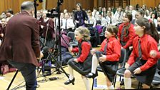 Dominic form the Ulster Youth Choir starts the warm up...