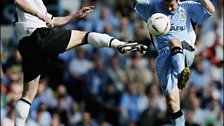 City's Michael Doyle challenges for the ball with County's Adam Bolder