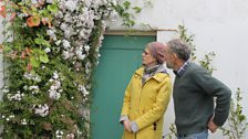 Cherrie with Head gardener Fergus Thompson admiring Jasmine in the conservatory