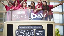 Sunderland acapella group Dodici Voce on top of the 'Hadrian's Wall of Sound' bus