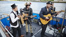 The Jar Family from Hartlepool perform on a boat at Newcastle Quayside