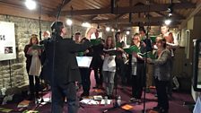 Paul Brough conducts the 鶹 Singers at Birdoswald Roman Fort Visitor Centre, Hadrian's Wall