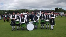 Liam with members of Portavogie Pipe Band